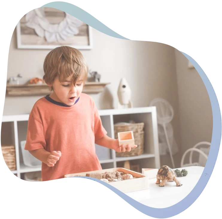 A child playing with Montessori materials in the classroom