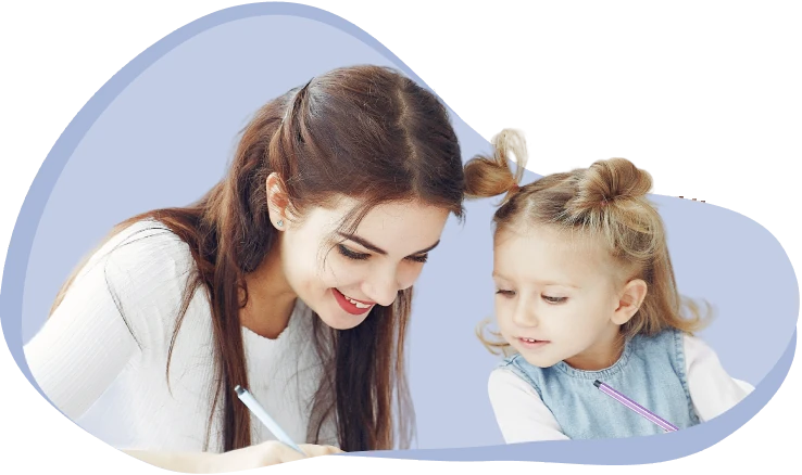 A therapist working with a girl on a language activity